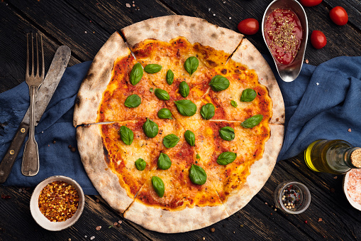 Classic Italian Pizza With Homemade Tomato Sauce, Basil And Mozzarella