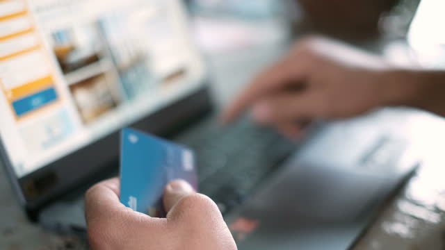 Man using credit card for casual shopping on laptop,web pay,tech e-commerce