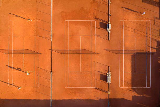 istock Tennis courts with players, aerial view 1301485830