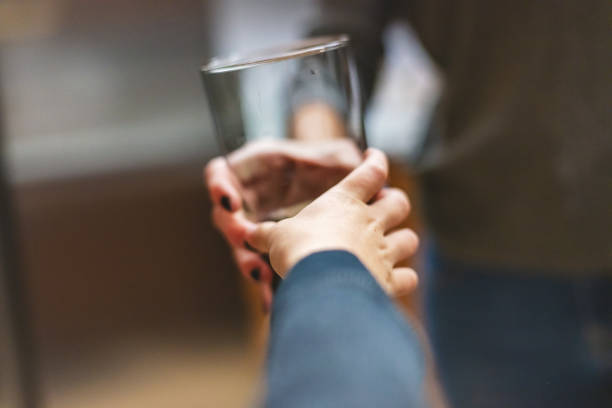 millennial mother and son spending time together at home in the kitchen mother's day photo series - love growth time of day cheerful imagens e fotografias de stock