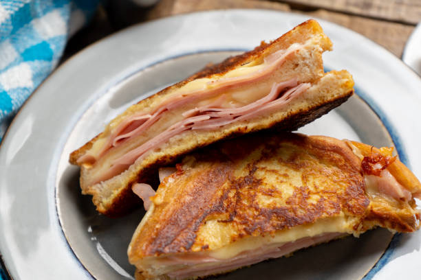 istock Ham and melted cheese sandwich called Monte Cristo on wooden background 1301488026