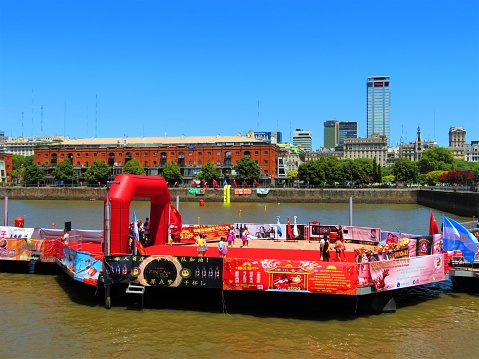 Buenos Aires, Argentina - January 26, 2020. The Chinese New Year celebration in Puerto Madero district. People  Celebrate The Chinese New Year.Dancers in traditional national costumes during The Chinese New Year period  for the festive celebrations.