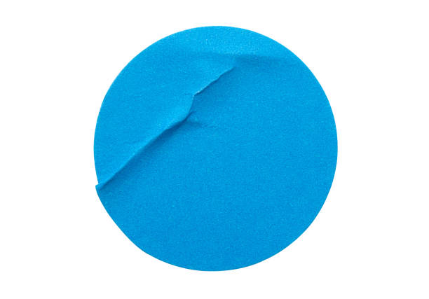 istock Blank blue round adhesive paper sticker label isolated on white background 1301492671