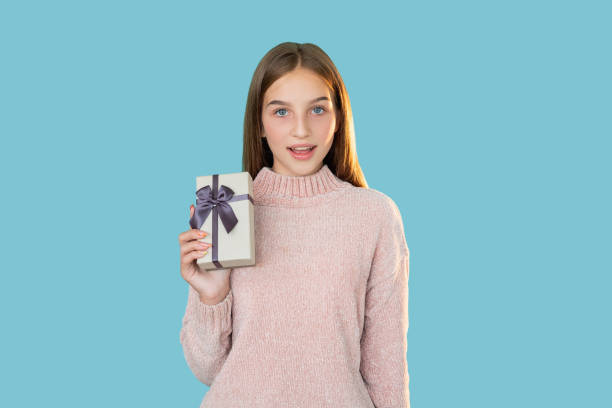 istock festive surprise christmas present girl gift box 1301492721