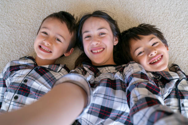 istock Siblings taking selfie photo on Christmas morning 1301492871