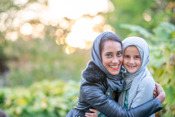 istock Beautiful Muslim mother and daughter 1301493911