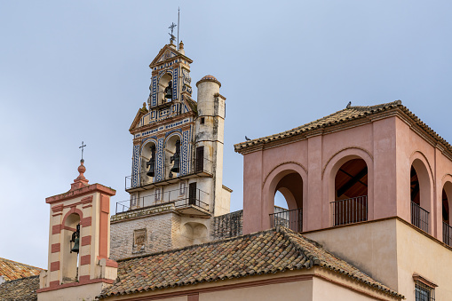 Ecija, Spain - 1 February, 2021: the Church of San Francisco at the Plaza de Espana in downtown Ecija