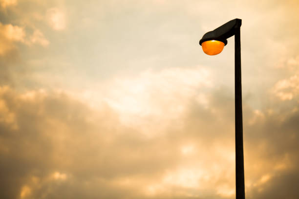 istock Street lamp on evening Golden sky and clouds background and copy space 1301498629