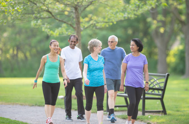 istock Multi ethnic group of seniors walking together 1301498728