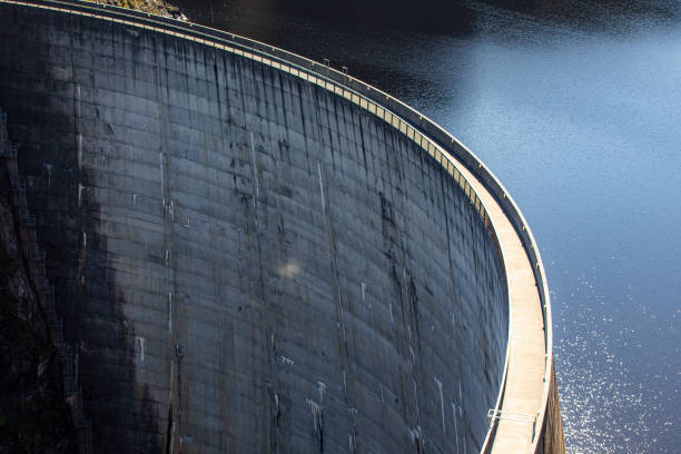 istock Cement dam wall creating hydro electricity aerial view 1301501262