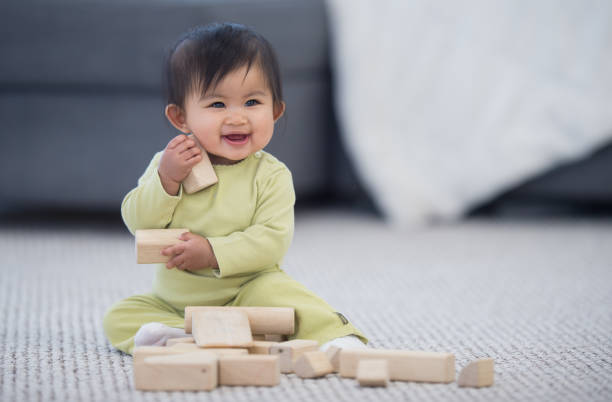 istock Adorable Filipino baby playing with blocks 1301504136