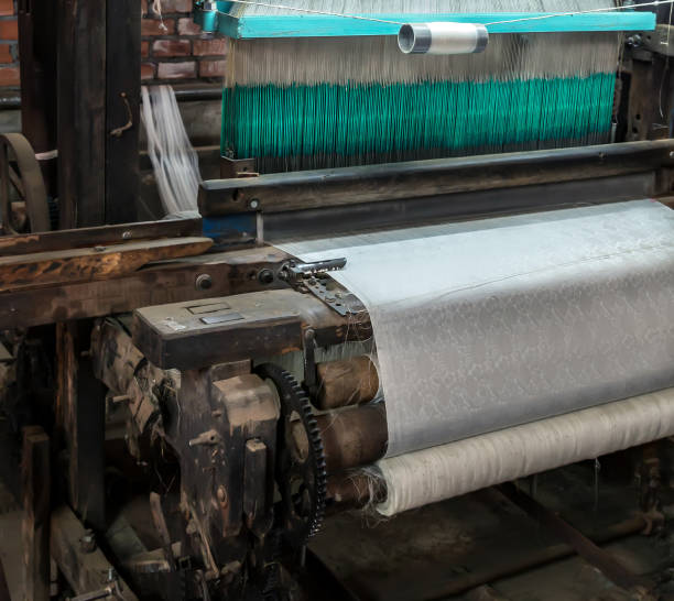 istock Handloom working weaving machine weave handmade fabric 1301505025