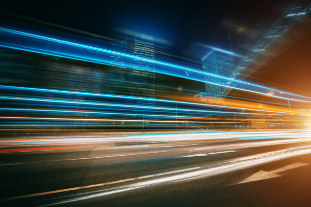 istock The light trails on the modern building background 1301507626