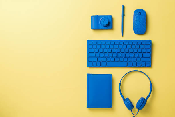 istock Blue office accessories on a light yellow background. Flat lay. 1301507668