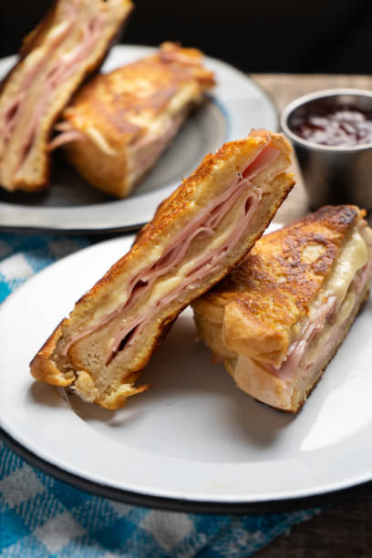 istock Ham and melted cheese sandwich called Monte Cristo on wooden background 1301510580