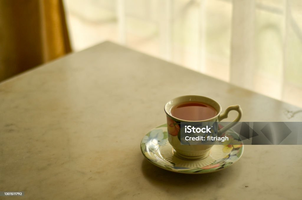 A Cup of Tea Chillin in the corner of the room. Breakfast Stock Photo