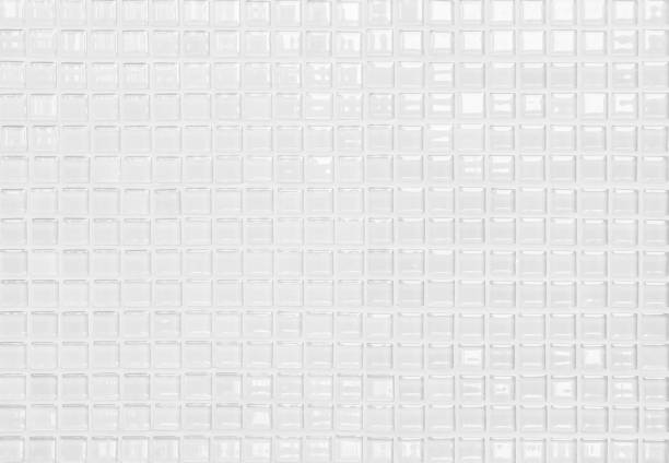 istock White or gray ceramic wall and floor tiles abstract background. Design geometric mosaic texture decoration of the bedroom. Simple seamless pattern for backdrop hospital wall, canteen and grid paper. 1301515521