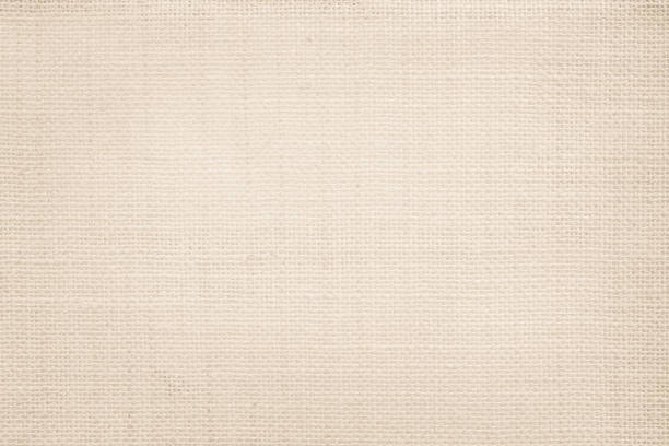 istock Jute hessian sackcloth canvas woven texture pattern background in light beige cream brown color blank empty 1301515527