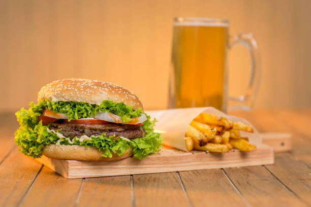 istock hamburger with vegetables on wooden board 1301518721