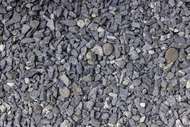 istock Stones texture and background. Rock texture . Crushed gravel background. Seamless texture of gravel for background. 1301519903