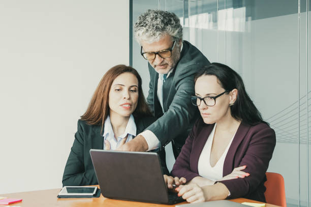 istock Group of top managers watching and discussing presentation 1301520546