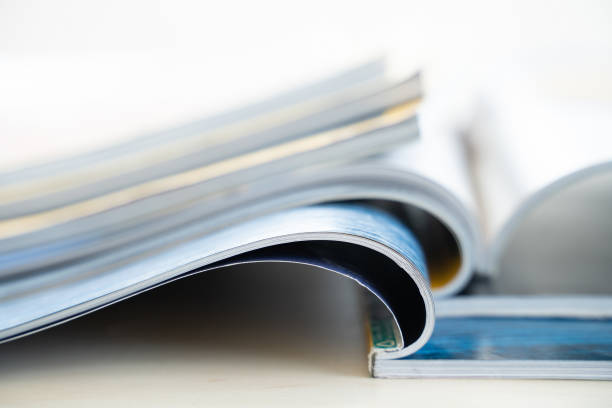 istock publication Newspaper and journal books background and catalog design article magazine press Newspaper with tablet 1301520554
