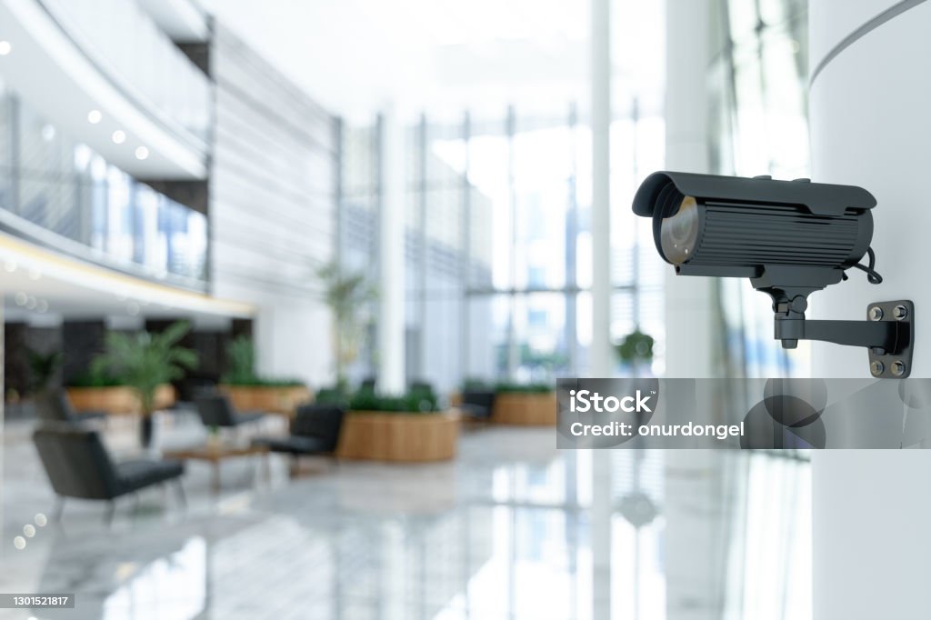 CCTV Camera In Luxury Hotel Lobby, In Modern Office Entrance Or In Shopping Mall On Blurry Background. Security Camera Stock Photo