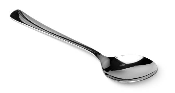 istock Silver spoon isolated on white background close up 1301523838