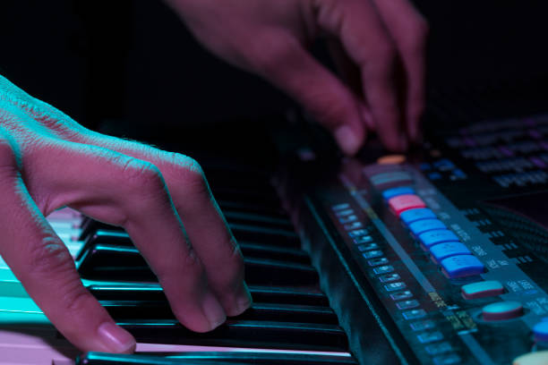 istock The musician's hand is playing a keyboard 1301524882