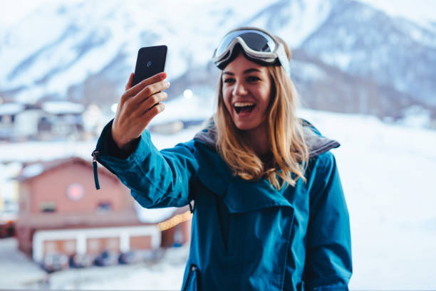 istock young  snowboarder woman 1301525649