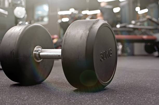istock barrels in a cellar close up of a dumbbell weights 1301525822