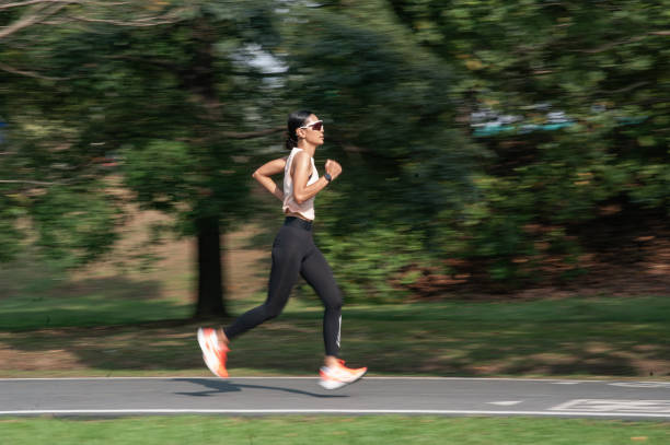 istock Young asian jogging and exercising at park 1301526140