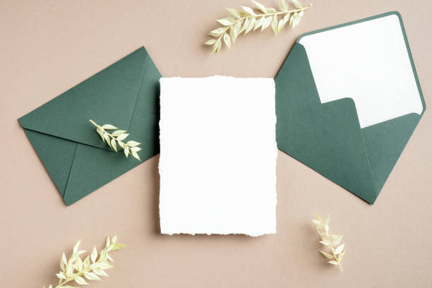 istock Wedding card and envelopes mockup with dried leaves. Flat lay, top view, copy space. 1301528380