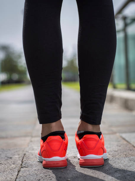 istock Runner feet running on road closeup on shoe 1301530335