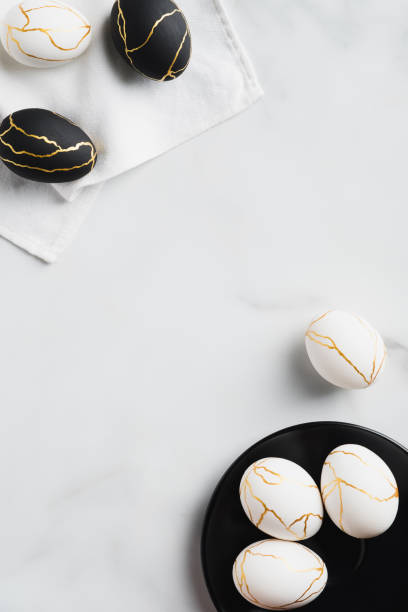 istock Frame of luxury Easter eggs on marble background. Flat lay, top view, Happy Easter vertical banner template 1301530420