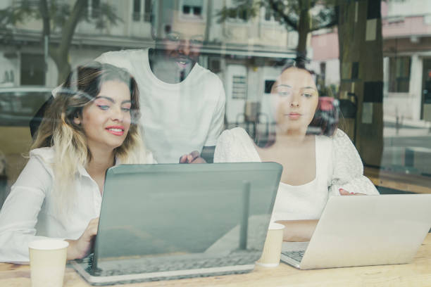 istock Multiethnic colleagues working indoors behind window 1301530449