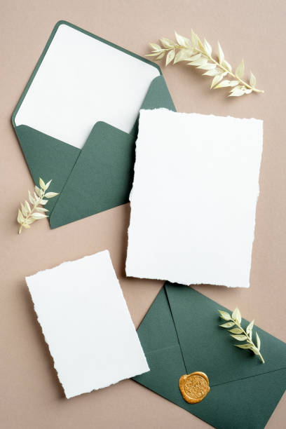 istock Wedding details, wedding envelope, wedding invitations on pastel beige background with dried flowers. 1301530630