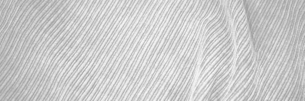 istock White abstract fabric background. Durable fabric texture background. Ribbed fabric with soft pleats. White elegant background. 1301530953