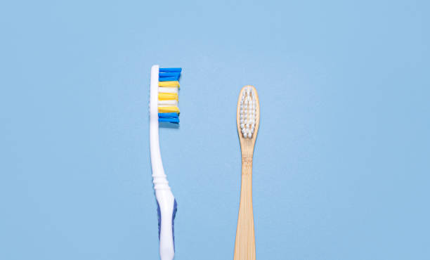 istock Natural eco friendly bamboo toothbrush and plastic toothbrush 1301532124