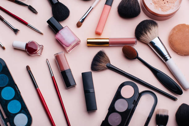istock Women's cosmetics and makeup set on pink background. Top view 1301534042