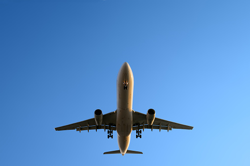 Aircraft landing with blue sky