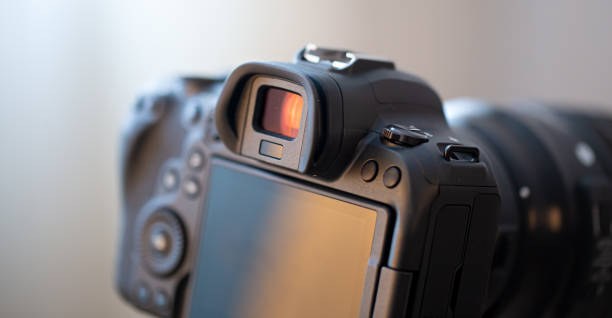 istock Close up part of a professional digital camera on a blurred background. 1301536834