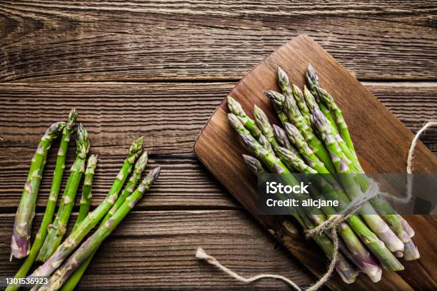Fresh Organic Asparagus Healthy Food Concept Stock Photo - Download Image Now - Asparagus, Wood - Material, Backgrounds