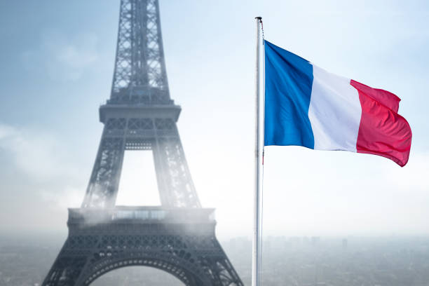 istock The Eiffel Tower and a French flag 1301538897