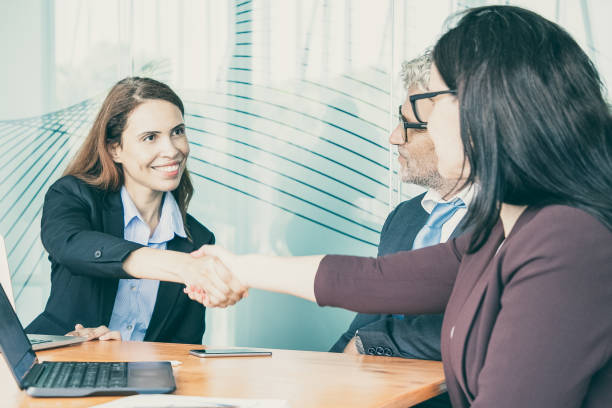 istock HR manager greeting employee in conference room 1301542365