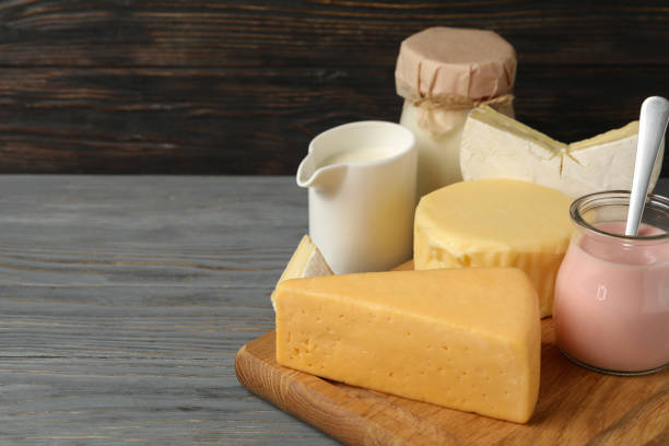 istock Different fresh dairy products on gray wooden background 1301545383