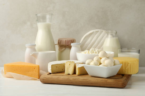 istock Different fresh dairy products on white wooden table 1301545471