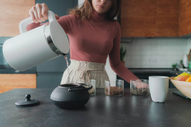 istock Woman brewing loose leaf tea 1301546926