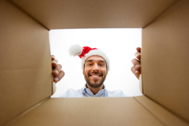 istock happy man opening parcel box or christmas gift 1301549017