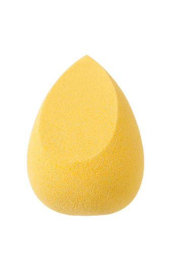 Yellow makeup blending sponge isolated over white